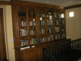 custom wood stained bookcase cabinet and crown moulding