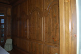 remodel dining room with custom wood paneling and stone mantle 
