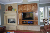remodel family room entertainment tv custom cabinet with stone fireplace mantle and crown moulding